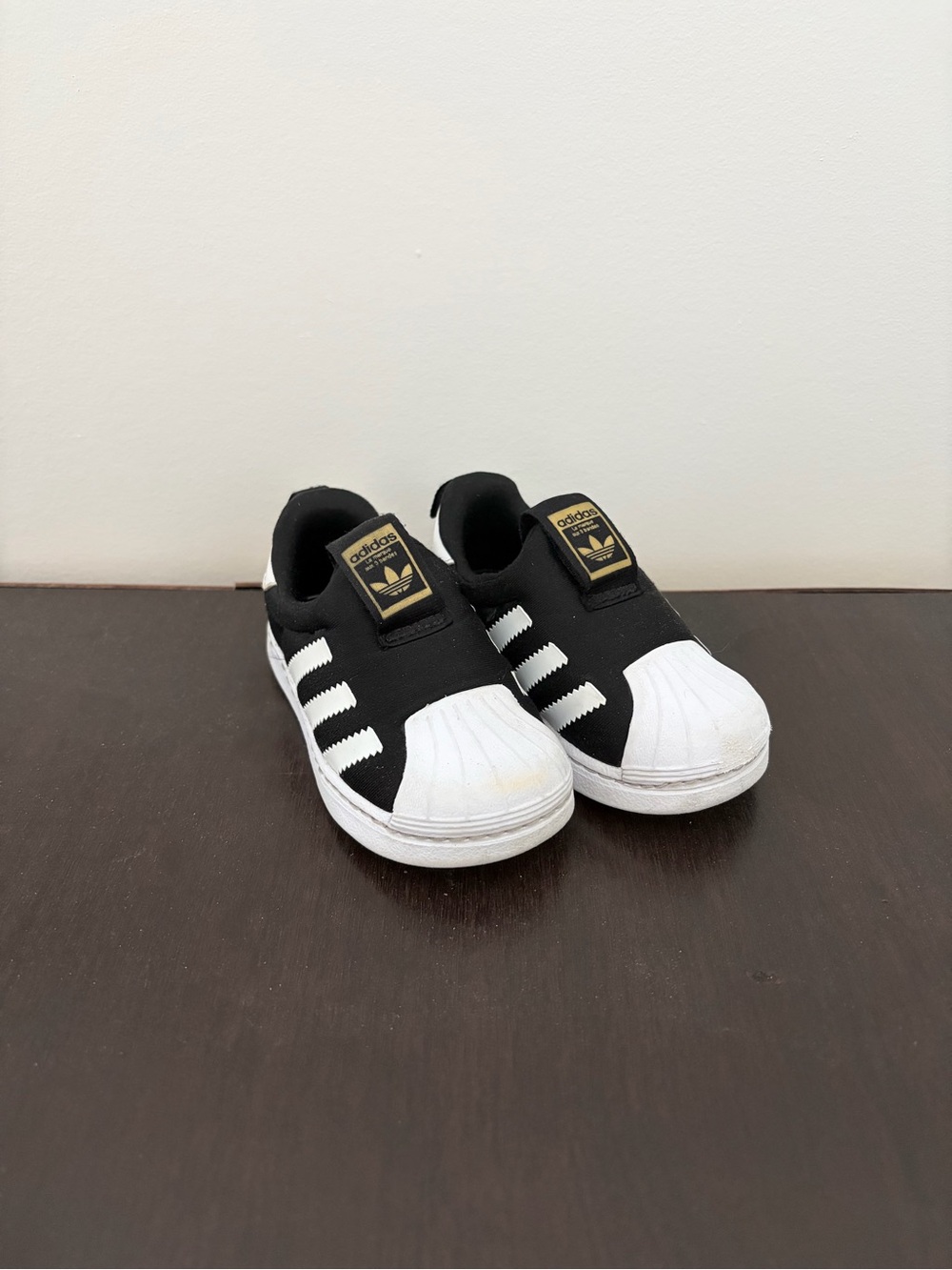 adidas toddlers Black & White Slip-On Superstar Sneakers with Gold Logo